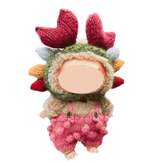 17cm crab flower knitted plush tutorial showing a small doll wearing a crab-inspired knitted hat and pink overalls