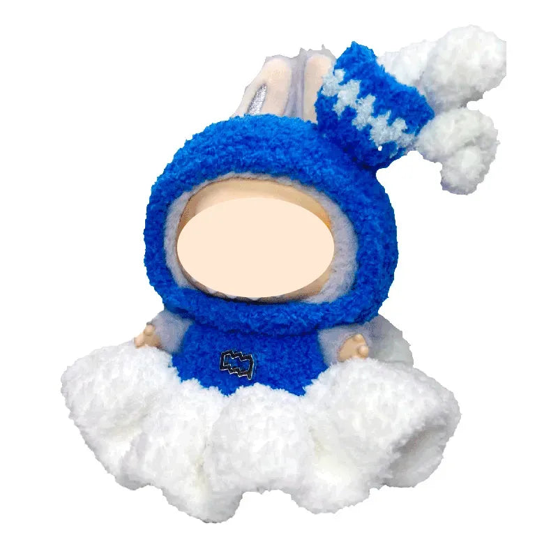 Plush toy of a baby in a blue snowsuit with a white background
