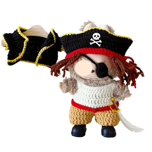 Crocheted pirate-themed toy with a hat, scarf, and sword on a white background