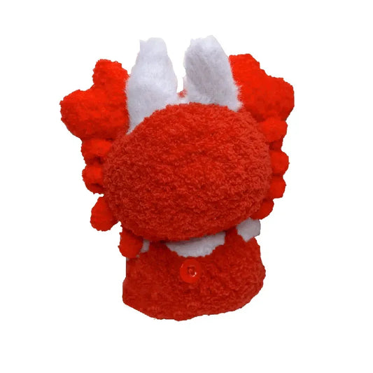 Red plush toy with white accents on a white background