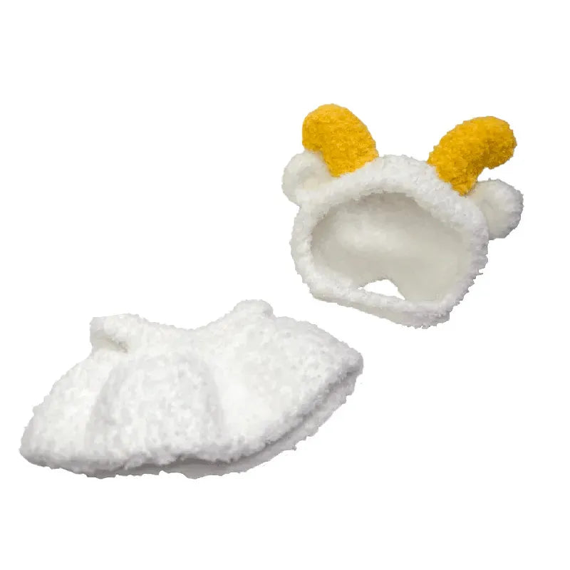 White baby booties with yellow accents on a white background