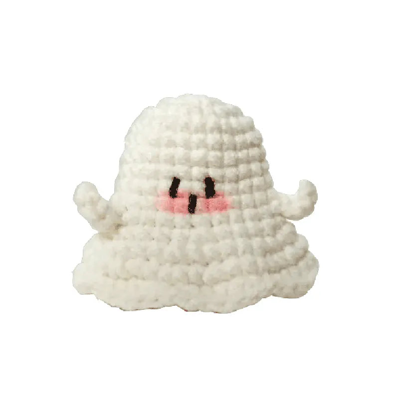 Small plush toy with a ghost design on a white background