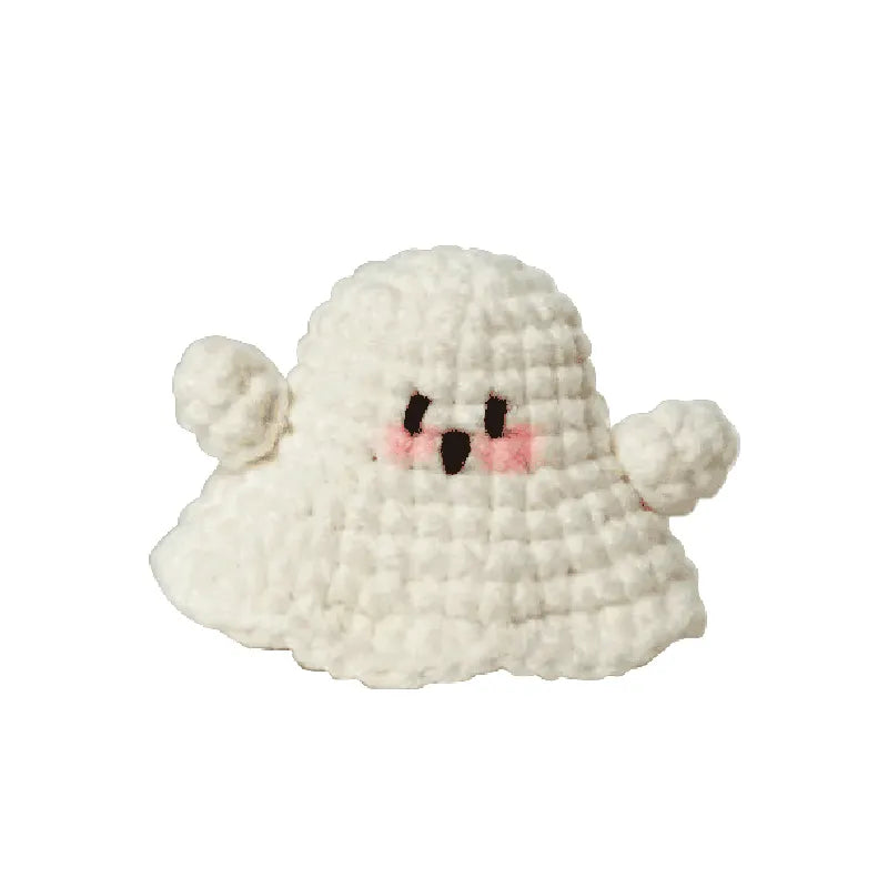 White plush toy with a cute face on a white background