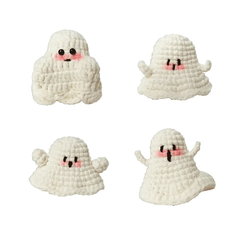 Four white crochet ghosts with black eyes and pink blush on a white background