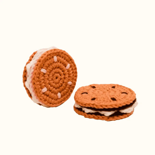 Handmade crochet sandwich cookies showing detailed brown yarn texture with white filling crochet sandwich cookie pattern free