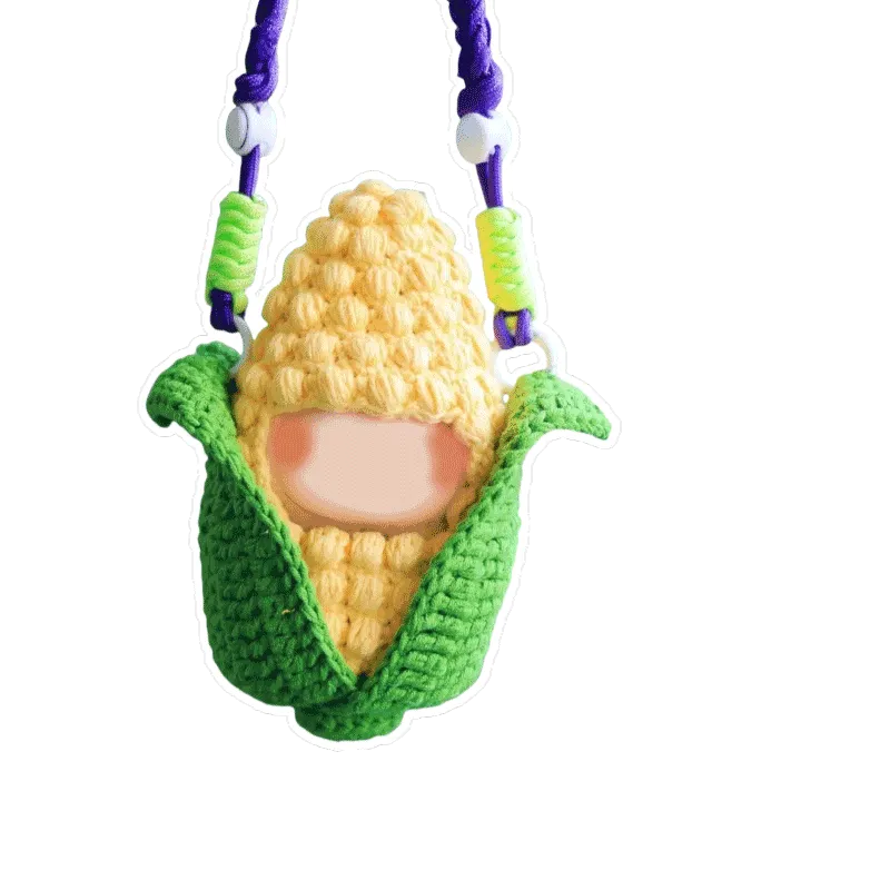 Amigurumi doll crochet kit featuring a handmade crocheted corn cob doll with green husk and yellow kernels