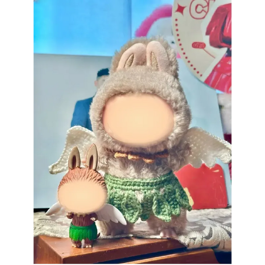 Handmade crochet dolls wearing a Beginner Crochet Doll Outfit with bunny ears and wings