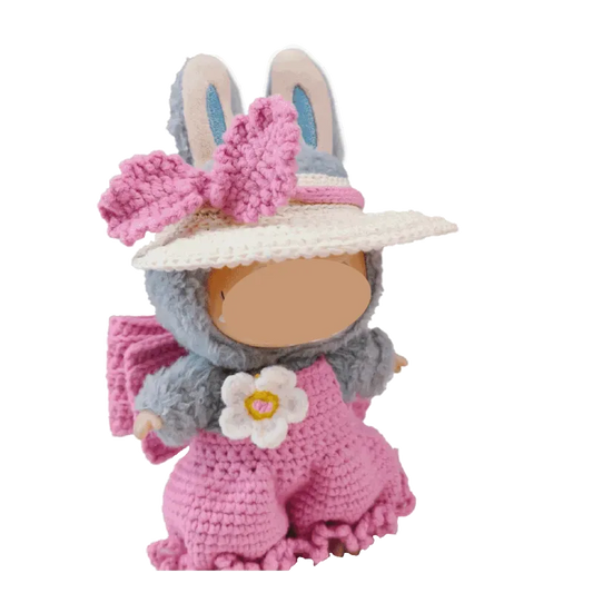 Plush doll wearing bubble pants crochet pattern for plush dolls in pink with flower and bunny ears hat
