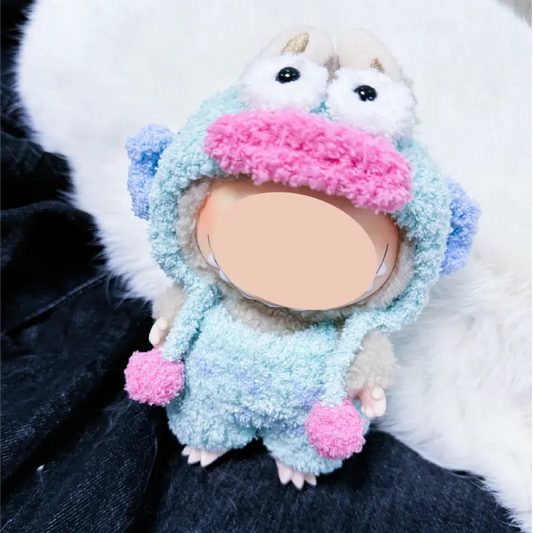 Cute handmade plush doll wearing a colorful fuzzy costume with eyes and pom-poms