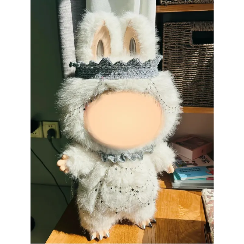 Collectible art doll crochet by The Knit Krazy wearing a fluffy bunny costume with crown
