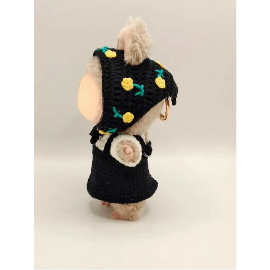Cute collectible doll crochet outfit in black with yellow flower accents on a small stuffed bear
