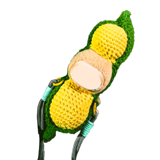 Creative crochet carrier for dolls in yellow and green with detailed handcrafted design