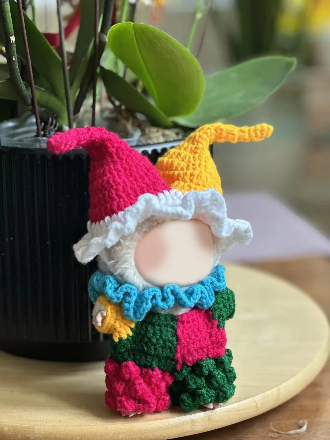 Crochet clown outfit pattern showcasing a colorful clown figure with a bright design