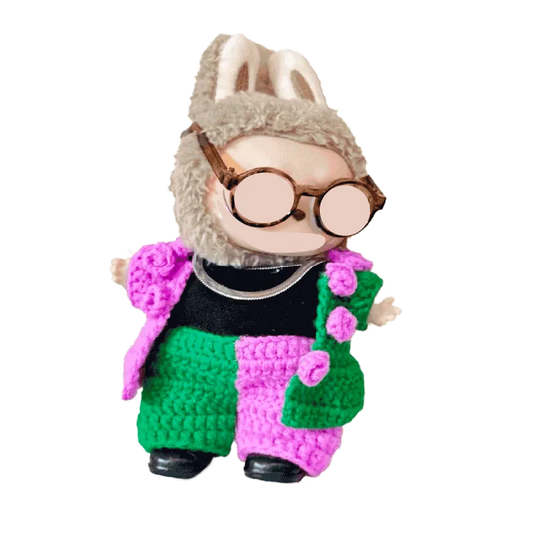 Plush bunny doll wearing a colorful crochet concert doll outfit pattern with glasses and a fuzzy hat