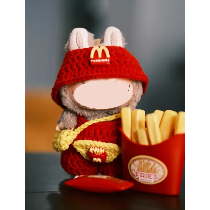 Colorful crochet fast food doll outfit pattern with blue yarn and textured fabric piece