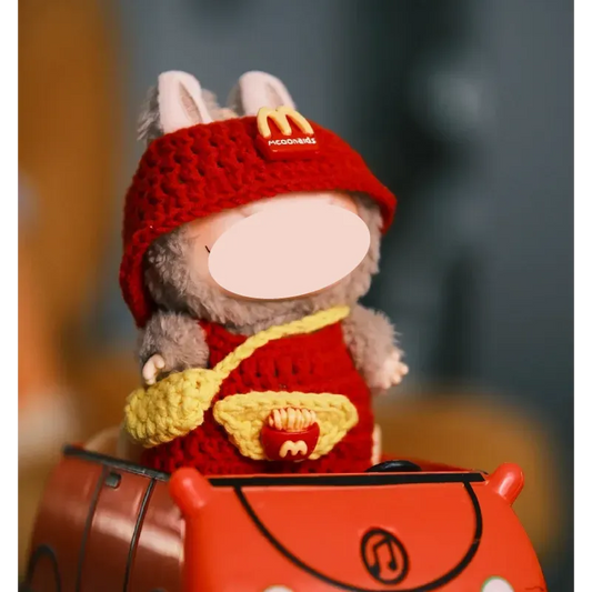 Crochet fast food doll outfit pattern featuring a colorful textured dress and a blue hat with bunny ears