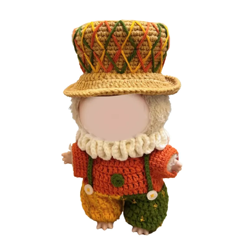 Crochet doll wearing a colorful hat and outfit made with the crochet little duke outfit pattern
