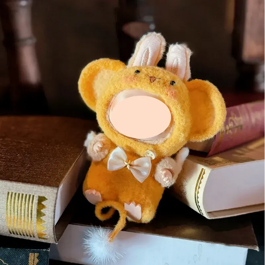 Cute handmade crochet monkey outfit pattern in yellow with bunny ears and bow sitting on books