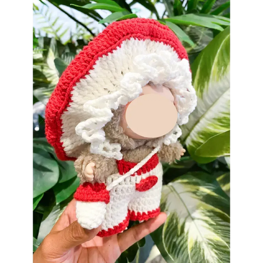 Hand holding a handmade Crochet Mushroom Doll featuring red and white colors from The Knit Krazy Crochet Mushroom Doll Pattern