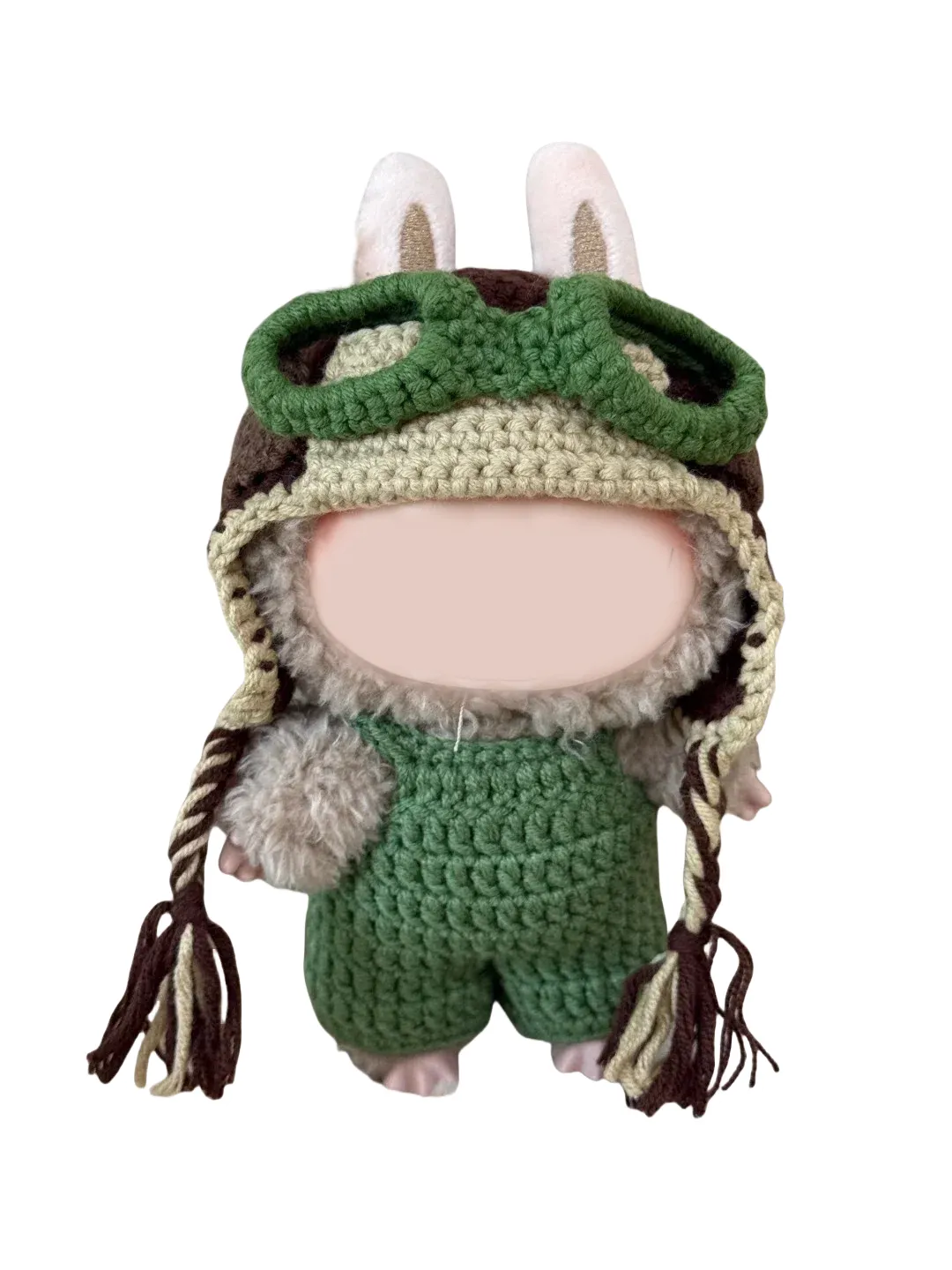 Handcrafted amigurumi doll wearing a crochet pilot hat pattern with green goggles and bunny ears