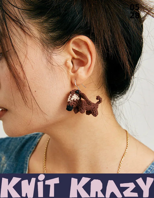 5.5mm turquoise crochet hook with colorful stitch markers and a tapestry needle for dachshund crochet earrings