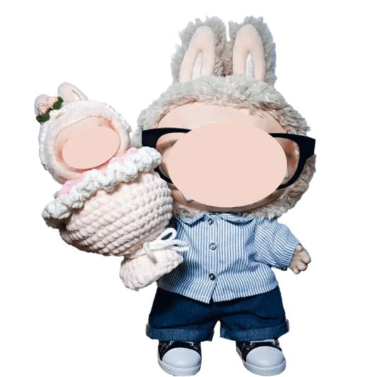 Cute doll wearing bunny ears holding a digital crochet bouquet pattern baby in white with pink accents