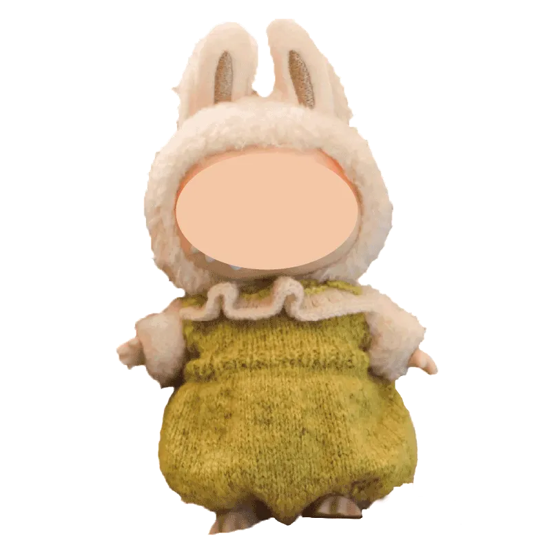 The Knit Krazy handmade doll dressed in a fluffy white bunny hood and green knitted outfit