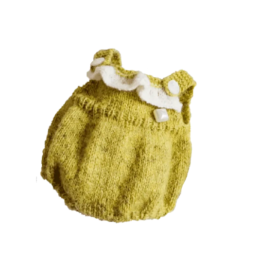 Handmade yellow knitted baby romper with white buttoned straps by The Knit Krazy