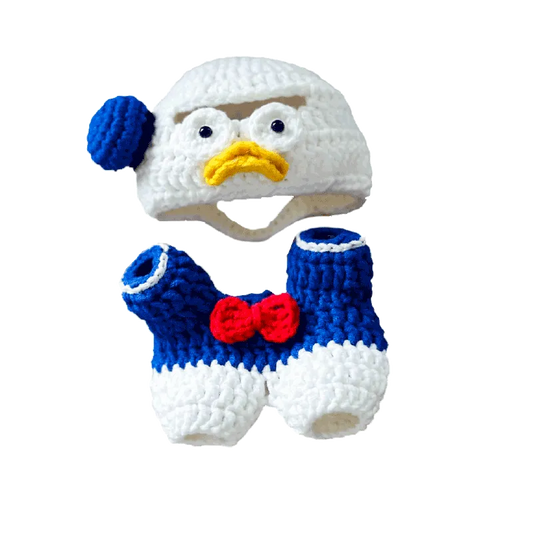 Donald Duck crochet pattern baby hat and shorts set with blue, white, red, and yellow yarn details