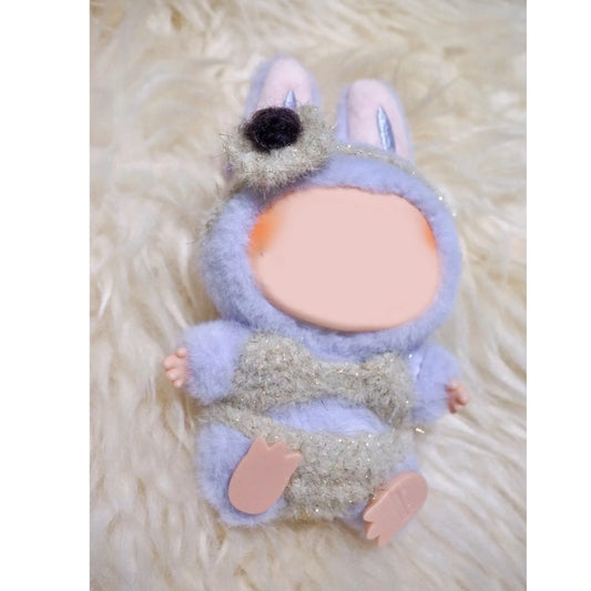 Handmade doll wearing a fuzzy crochet bikini set in pastel colors featuring the free crochet bikini doll pattern