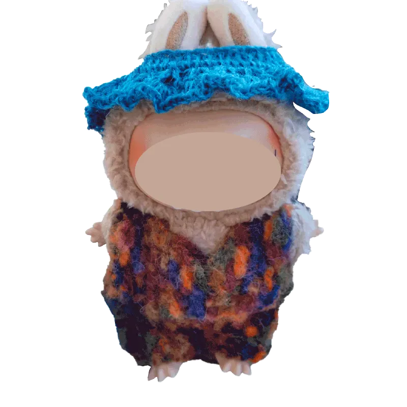 Plush doll wearing a colorful crochet collar and blue hat using FREE|crochet collar and hat pattern for plush dolls