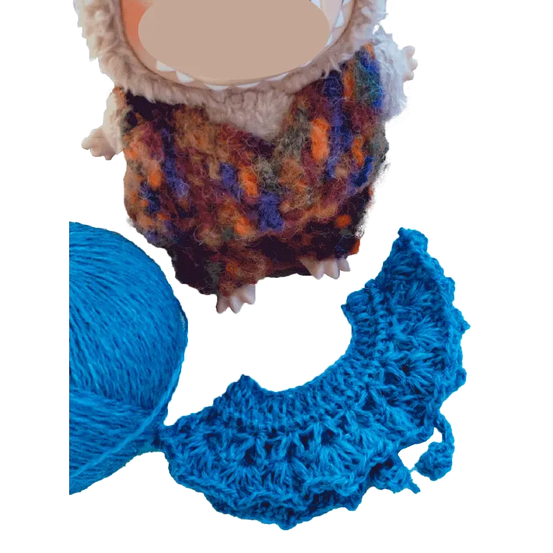 FREE|crochet collar and hat pattern for plush dolls shown with blue crocheted collar and yarn ball