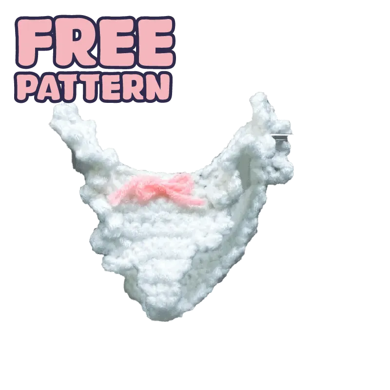 White crocheted doll panties with pink bow showcasing free-crochet doll panties pattern on black background