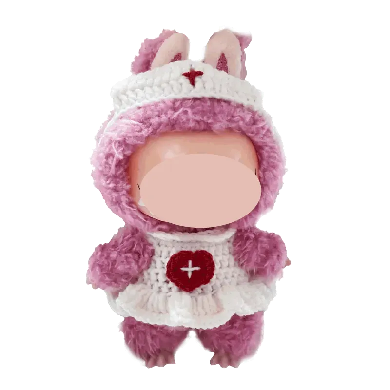 Cute handmade doll wearing a pink and white free crochet nurse outfit pattern with bunny ears
