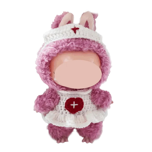 Cute handmade doll wearing a pink and white free crochet nurse outfit pattern with bunny ears