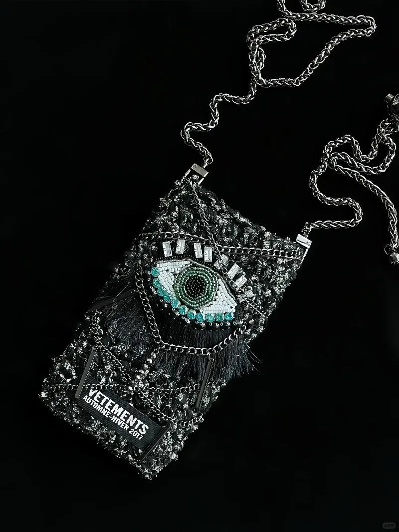 FREE|cyberpunk crochet phone bag pattern featuring a detailed eye design and chain strap by redbook