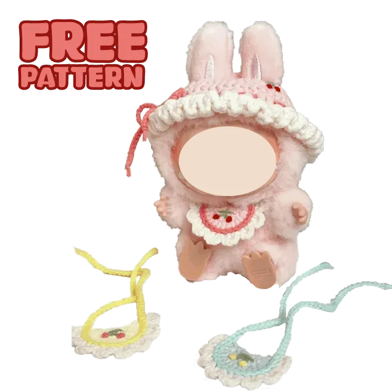 Cute plush doll wearing colorful crochet hat and pink overalls with FREE|plush toy hat and bib crochet tutorial