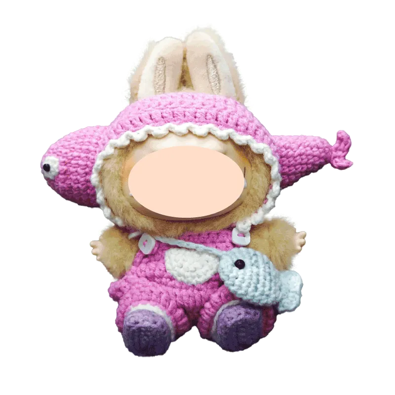 Funny fish crochet doll outfit pattern in pink worn by plush doll with bunny ears