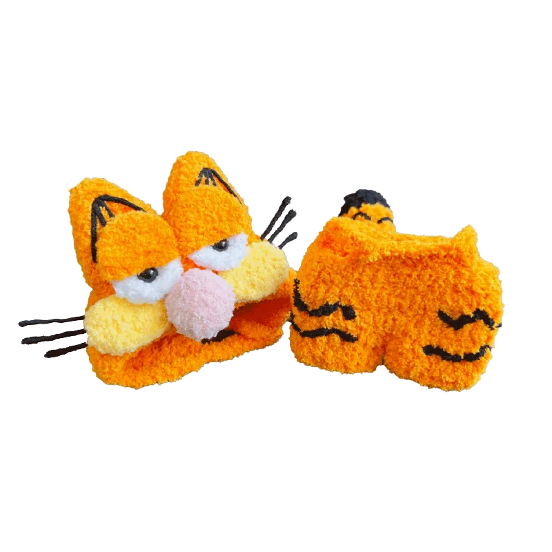 Garfield-inspired crochet pattern for dolls featuring detailed orange cat face and paws