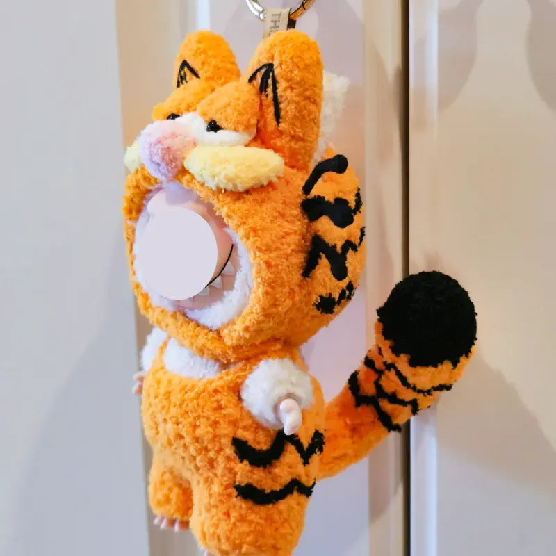 Garfield-inspired crochet pattern for dolls featuring two handmade tiger costumes with orange and beige yarn