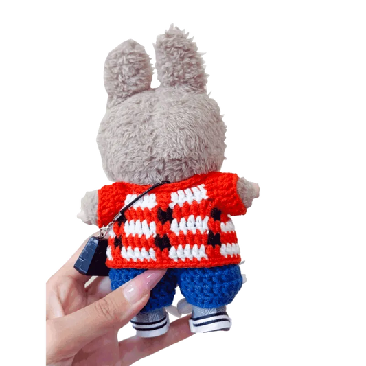 Plush bunny doll wearing GD inspired crochet doll clothes including red and white checkered top and blue pants