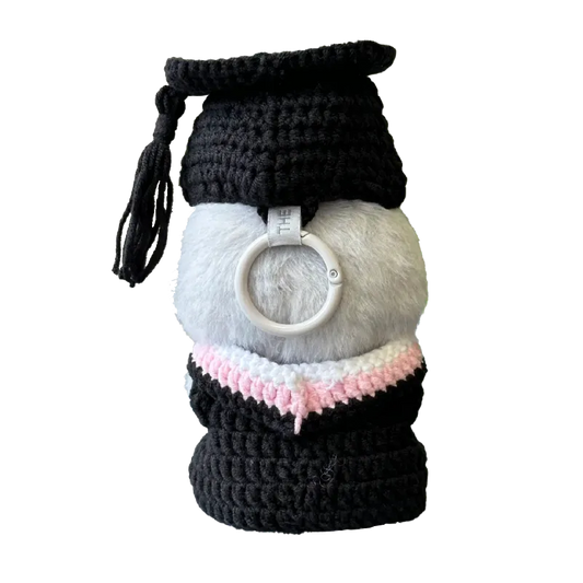 Handmade graduation doll crochet pattern with black cap and gown and pink collar detail