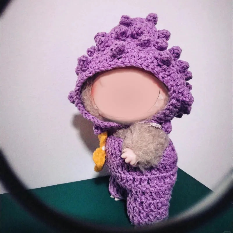 Purple beginner crochet doll outfit on small doll with textured hood designed for beginners
