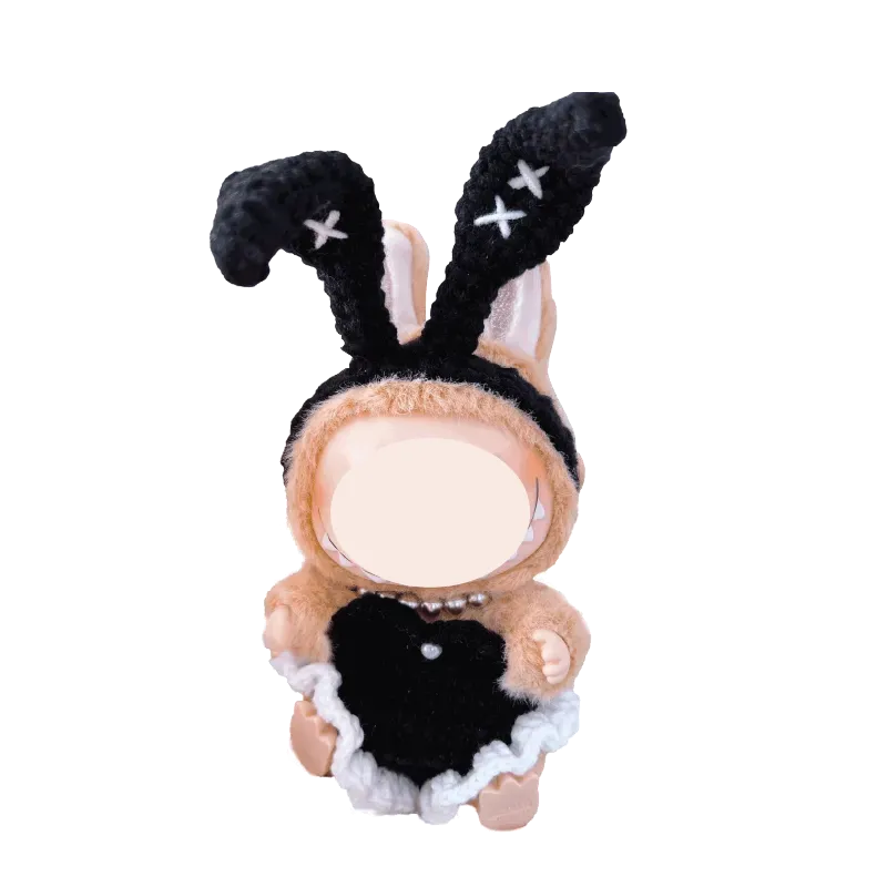Bunny girl crochet doll outfit pattern featuring black bunny ears and dress on small doll