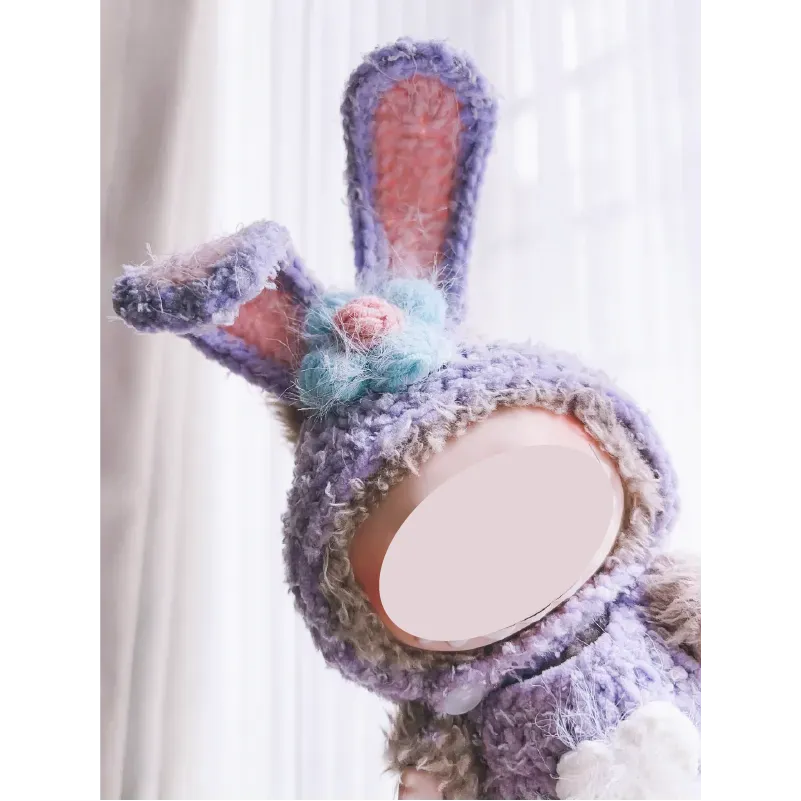 Collectible crochet dolls pattern featuring a purple bunny with long ears and a flower detail