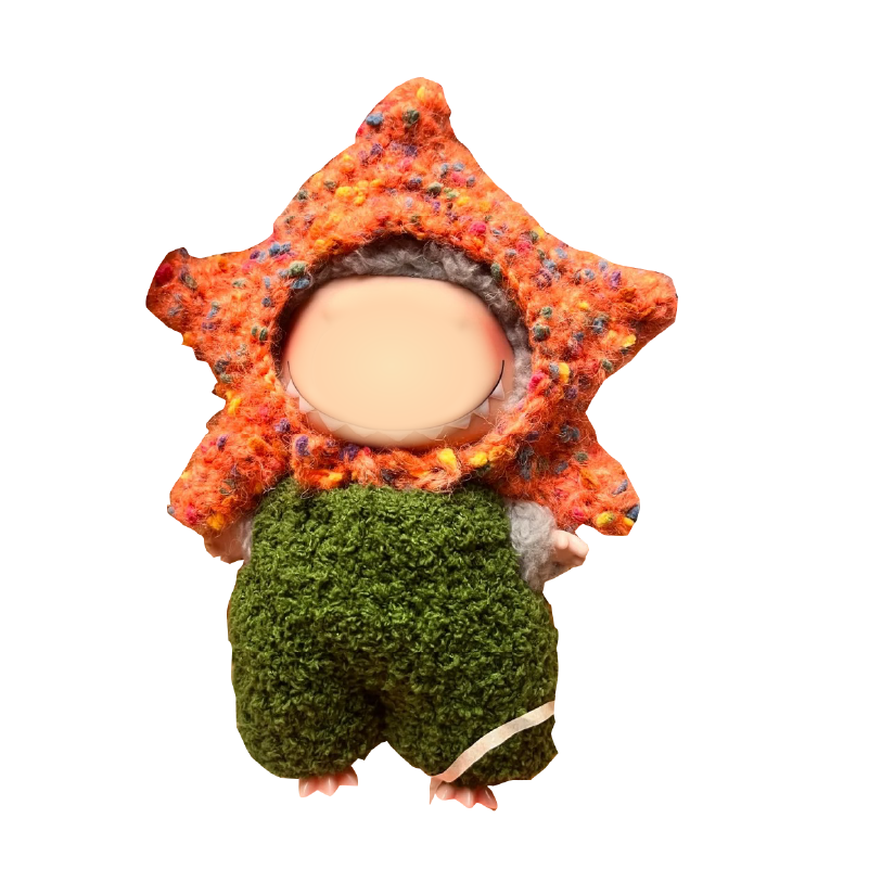 Crochet doll wearing a handmade green and orange outfit from crochet doll outfit pattern by redbook