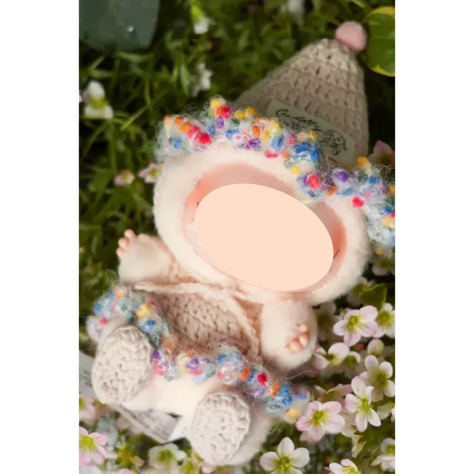 Cute crochet doll clothes featuring a multicolored trim on a soft knitted outfit from The Knit Krazy