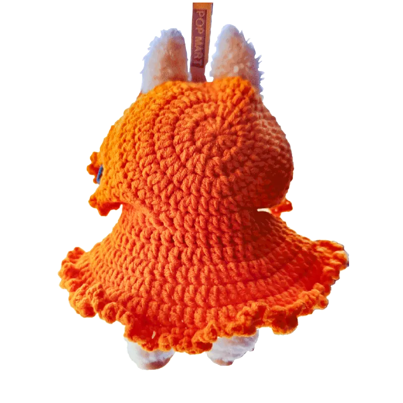 Handmade orange crocheted DIY Halloween doll costume with ruffled edges for small dolls