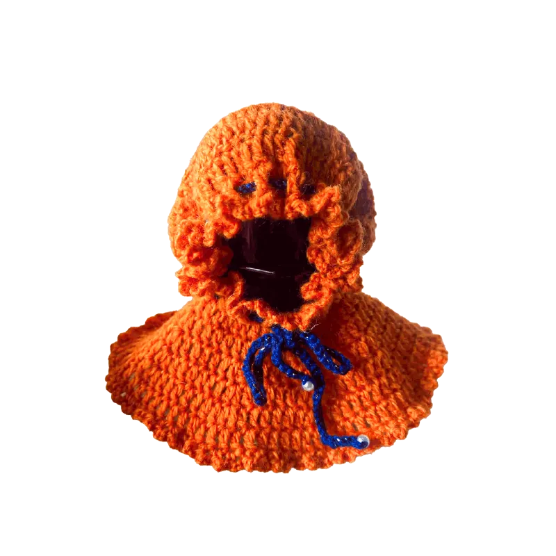 Handmade orange crocheted hoodie shown as a DIY Halloween doll costume with blue tie string