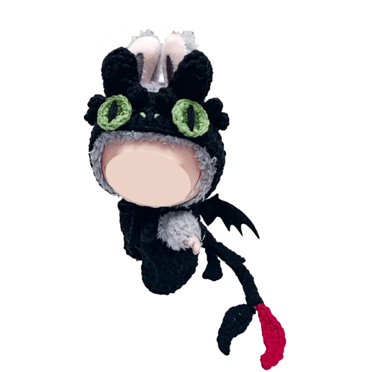 White handmade night dragon crochet pattern with pearl accents on red knitted background